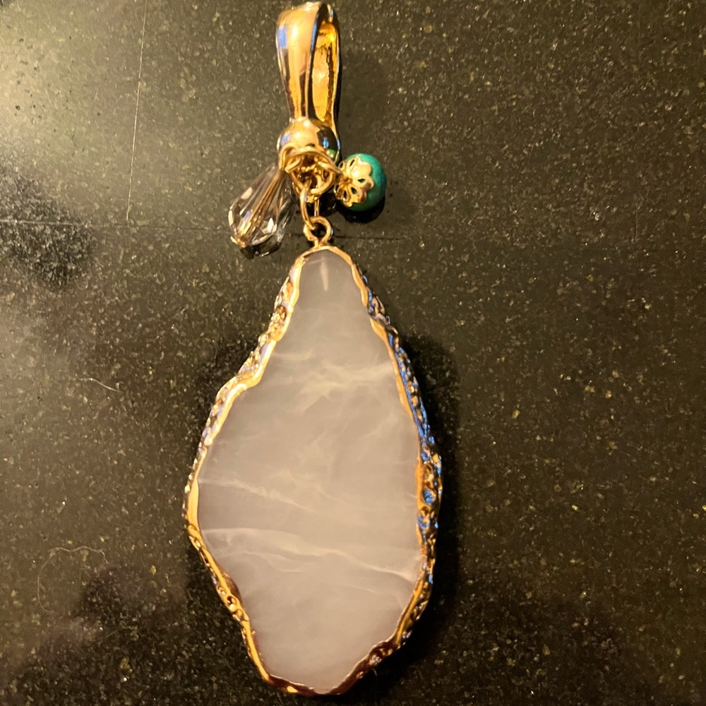 Wearable art by Roman white stone with gold trim